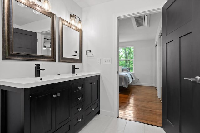 216 Trenton St, Chattanooga, TN 37415 - full bathroom with double vanity, ensuite bathroom, and tile patterned flooring