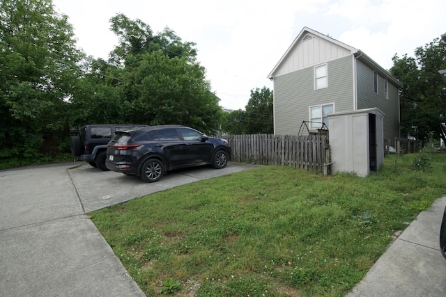 808 Fairview Ave, Chattanooga, TN 37403 - view of side of home featuring board and batten siding and concrete driveway