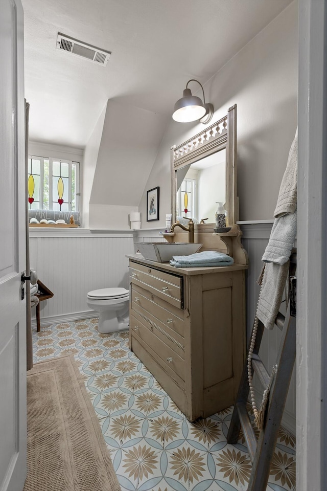 302 S Main St, La Fayette, GA 30728 - bathroom with a wainscoted wall, vanity, and vaulted ceiling