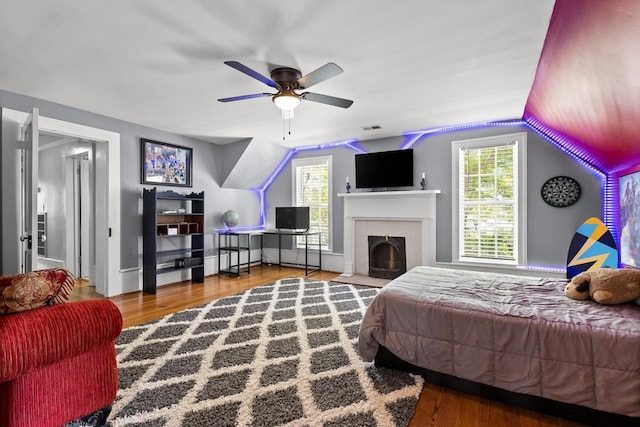 302 S Main St, La Fayette, GA 30728 - bedroom featuring wood finished floors, lofted ceiling, and a fireplace with flush hearth