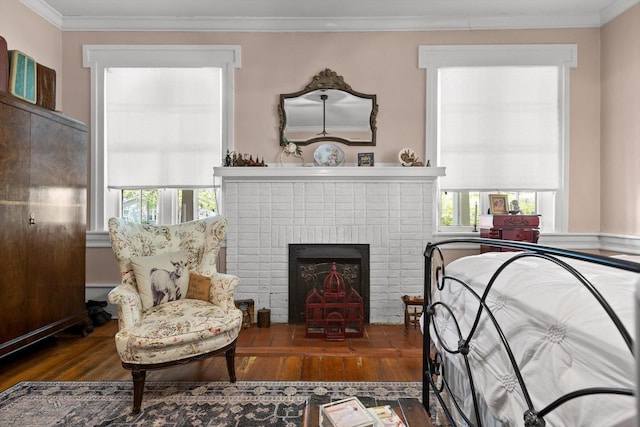 302 S Main St, La Fayette, GA 30728 - bedroom with hardwood / wood-style flooring, crown molding, multiple windows, and a brick fireplace