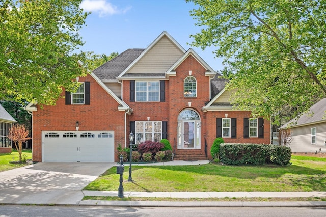 6970 Bullock Way, Hixson, TN 37343 - view of front of property with a garage, a front yard, concrete driveway, brick siding, and entry steps