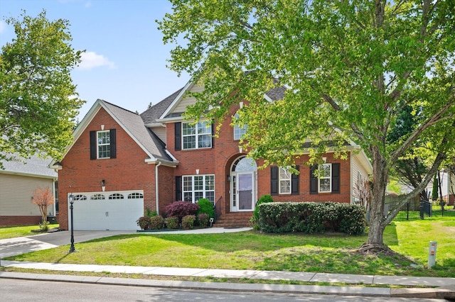 6970 Bullock Way, Hixson, TN 37343 - view of front of home with a garage, brick siding, driveway, and a front lawn
