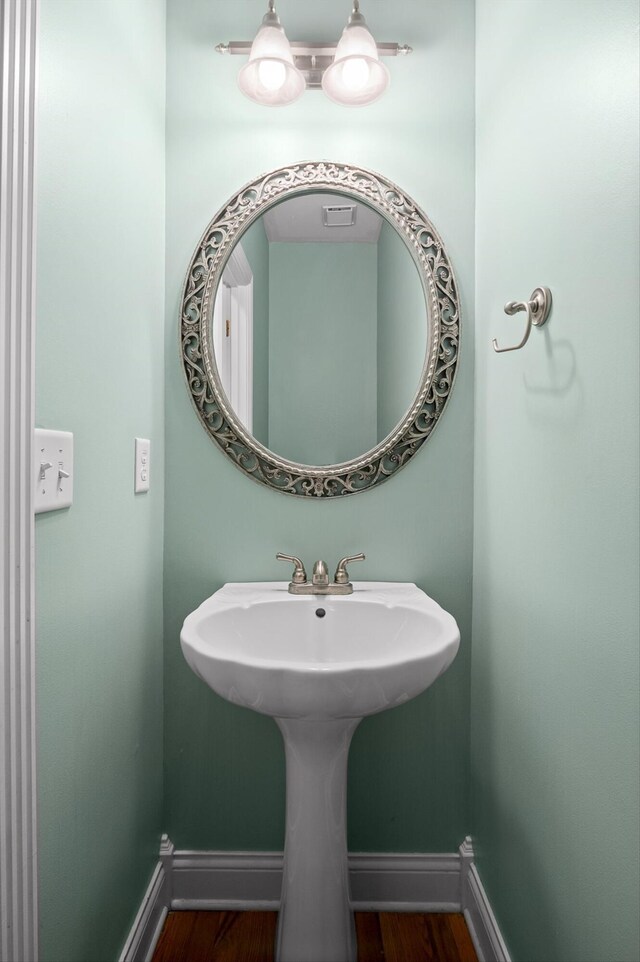 6970 Bullock Way, Hixson, TN 37343 - bathroom featuring baseboards and wood finished floors