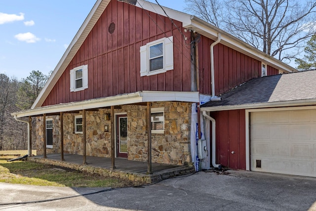 610 Orme Mountain Rd, South Pittsburg, TN 37380 - view of front facade with stone siding, board and batten siding, a porch, and asphalt driveway