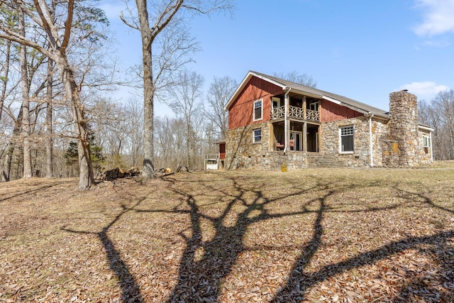 610 Orme Mountain Rd, South Pittsburg, TN 37380 - view of property exterior with stone siding, a chimney, a balcony, and a yard