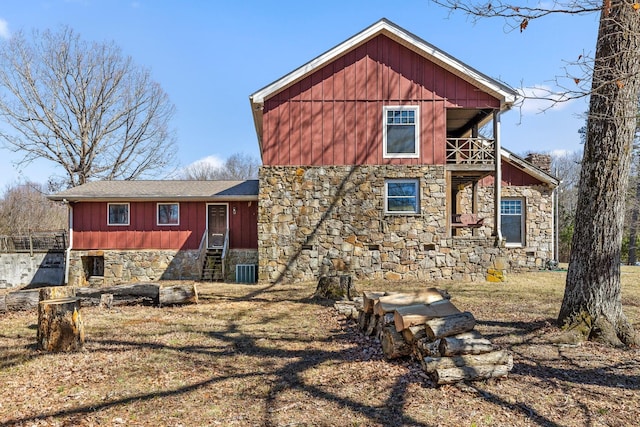 610 Orme Mountain Rd, South Pittsburg, TN 37380 - rear view of property featuring stone siding, a balcony, board and batten siding, and a yard