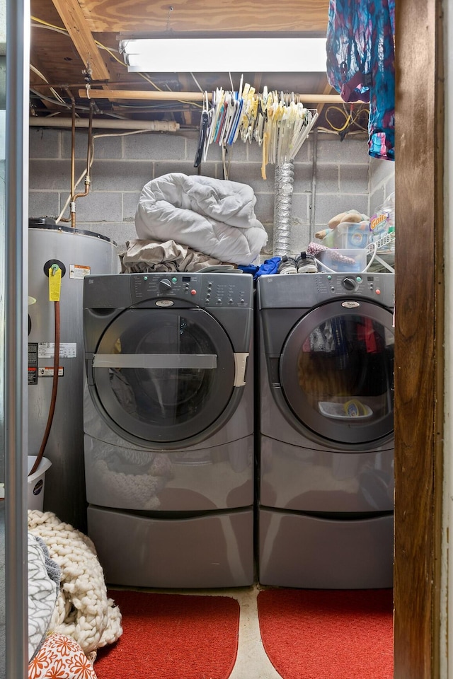 131 Sioux Trl, Ringgold, GA 30736 - washroom with water heater, concrete block wall, and washer and clothes dryer