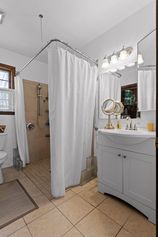 3216 Cleveland Hwy, Dalton, GA 30721 - bathroom featuring vanity, tiled shower, and tile patterned flooring
