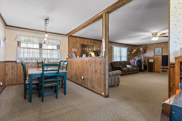 3216 Cleveland Hwy, Dalton, GA 30721 - dining area with crown molding, a textured ceiling, wooden walls, wallpapered walls, and carpet floors