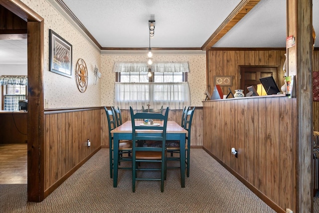 3216 Cleveland Hwy, Dalton, GA 30721 - carpeted dining space featuring ornamental molding, wood walls, wallpapered walls, and a wainscoted wall