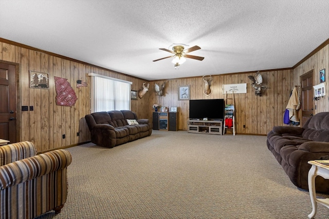 3216 Cleveland Hwy, Dalton, GA 30721 - carpeted living room featuring crown molding, wooden walls, a ceiling fan, and a textured ceiling