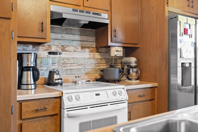 3216 Cleveland Hwy, Dalton, GA 30721 - kitchen featuring electric stove, stainless steel refrigerator with ice dispenser, under cabinet range hood, light countertops, and wood walls