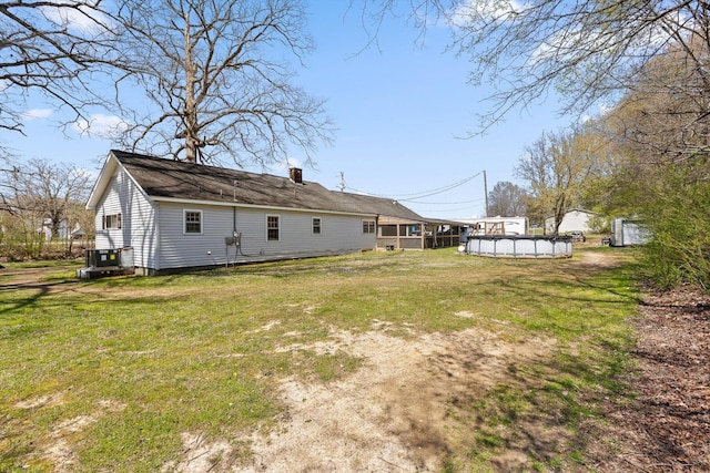 3216 Cleveland Hwy, Dalton, GA 30721 - rear view of house featuring an outdoor pool, a yard, and a chimney