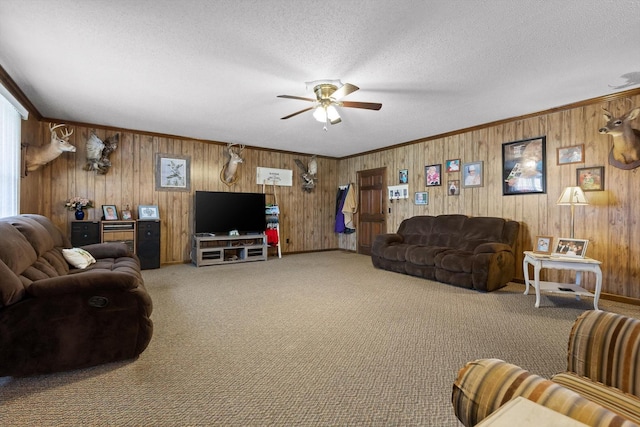 3216 Cleveland Hwy, Dalton, GA 30721 - living room with ceiling fan, carpet floors, wooden walls, a textured ceiling, and ornamental molding