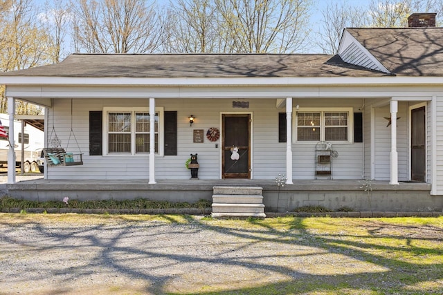3216 Cleveland Hwy, Dalton, GA 30721 - view of front of house featuring covered porch and a chimney