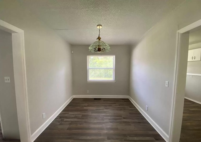 604606 N Moore Rd, Chattanooga, TN 37411 - unfurnished dining area featuring dark wood-style flooring and a textured ceiling