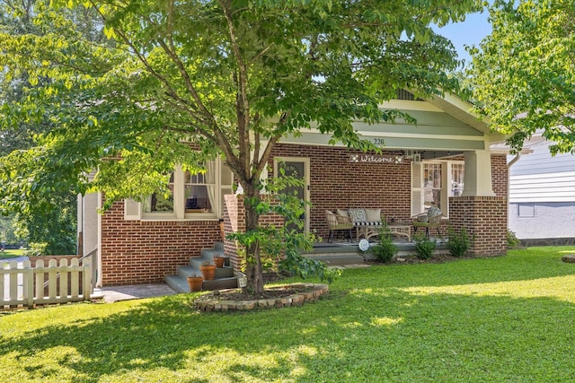 220 Hillcrest Ave, Chattanooga, TN 37411 - view of front facade with brick siding, a front lawn, and covered porch