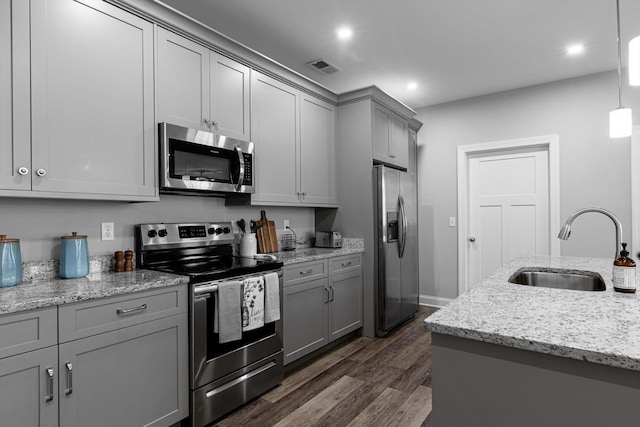 9614 Mulberry Gap Way, Ooltewah, TN 37363 - kitchen featuring stainless steel appliances, gray cabinetry, dark wood-style flooring, recessed lighting, and light stone counters