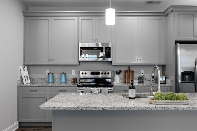 9614 Mulberry Gap Way, Ooltewah, TN 37363 - kitchen with appliances with stainless steel finishes, gray cabinetry, and light stone countertops