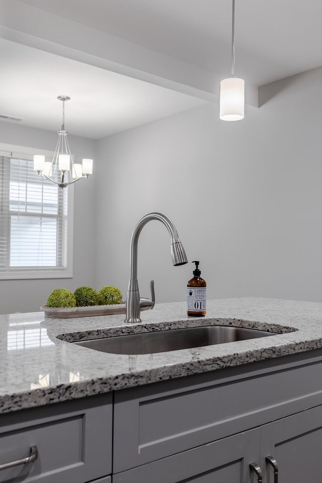 9614 Mulberry Gap Way, Ooltewah, TN 37363 - kitchen view of gray cabinets, light stone countertops, pendant lighting, and a chandelier