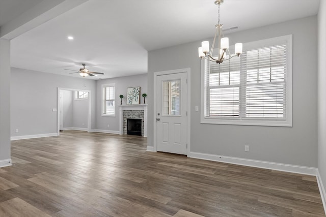 9614 Mulberry Gap Way, Ooltewah, TN 37363 - unfurnished living room with a chandelier, a ceiling fan, wood finished floors, and a fireplace