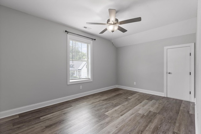 9614 Mulberry Gap Way, Ooltewah, TN 37363 - empty room featuring a ceiling fan, wood finished floors, and vaulted ceiling