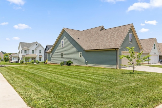 9614 Mulberry Gap Way, Ooltewah, TN 37363 - view of property exterior with driveway, roof with shingles, a lawn, and a garage