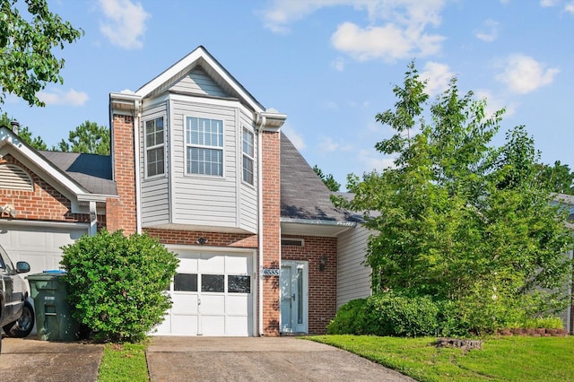 6585 Hickory Trace Cir, Chattanooga, TN 37421 - view of front of house featuring brick siding, concrete driveway, and an attached garage