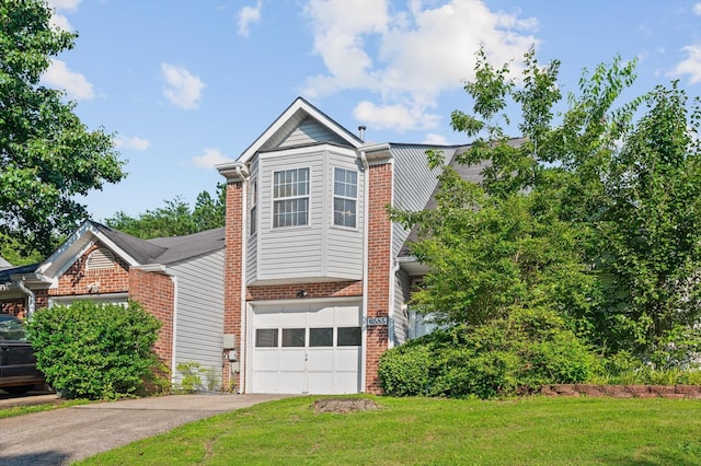 6585 Hickory Trace Cir, Chattanooga, TN 37421 - view of front of property with brick siding, driveway, an attached garage, and a front lawn