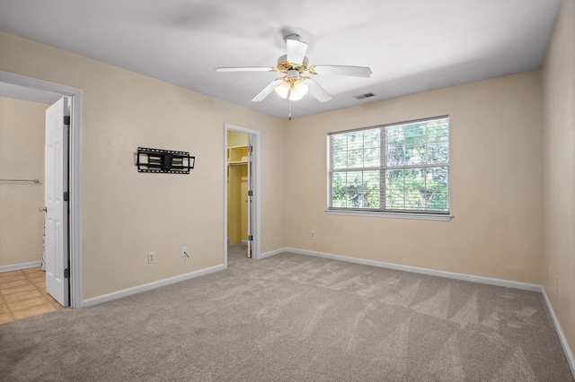 6585 Hickory Trace Cir, Chattanooga, TN 37421 - unfurnished bedroom featuring a walk in closet, carpet, a closet, a ceiling fan, and ensuite bath