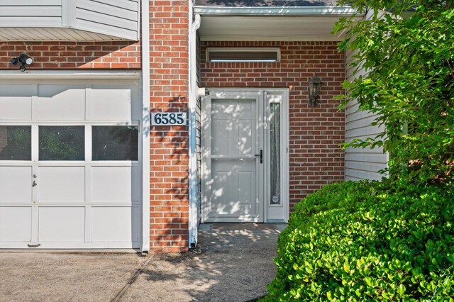 6585 Hickory Trace Cir, Chattanooga, TN 37421 - doorway to property with brick siding and a garage