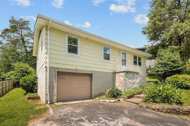 6557 Esquire Dr, Hixson, TN 37343 - view of front of property with an attached garage and asphalt driveway