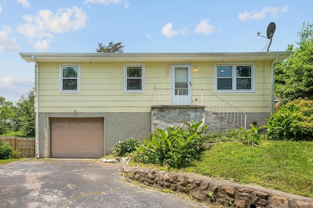 6557 Esquire Dr, Hixson, TN 37343 - view of front facade with a garage and asphalt driveway
