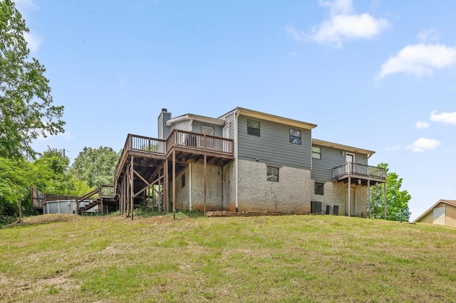 411 Meadow Green Dr, Ringgold, GA 30736 - rear view of property with stairway, a yard, a wooden deck, and a chimney