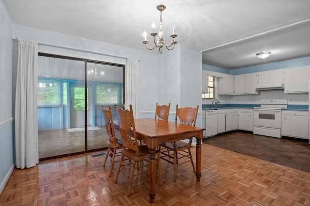 7622 Cove Ridge Dr, Hixson, TN 37343 - dining area with a chandelier and a textured ceiling