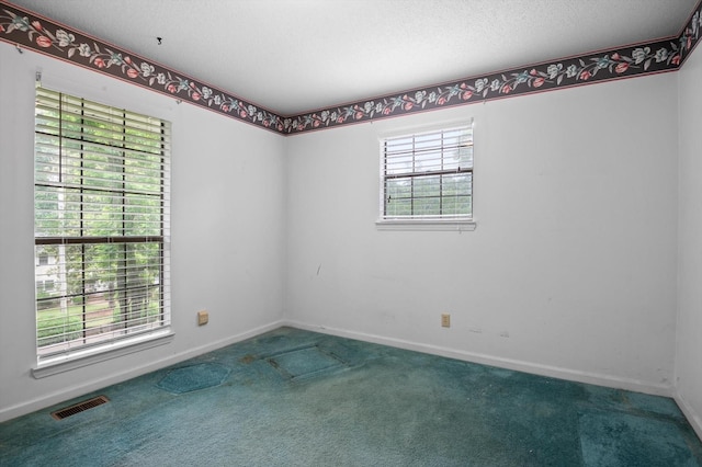 7622 Cove Ridge Dr, Hixson, TN 37343 - carpeted empty room featuring baseboards and a textured ceiling