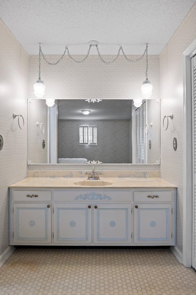 7622 Cove Ridge Dr, Hixson, TN 37343 - bathroom with vanity and a textured ceiling