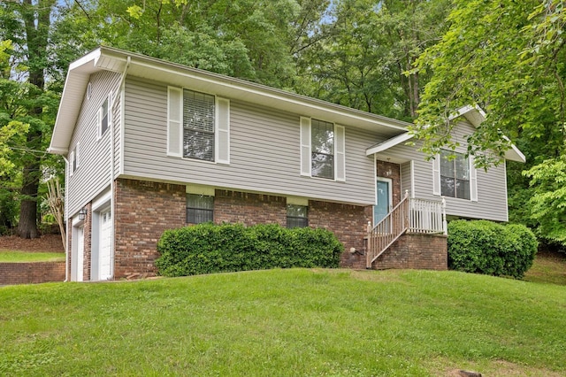 7622 Cove Ridge Dr, Hixson, TN 37343 - raised ranch with brick siding, a front lawn, and an attached garage