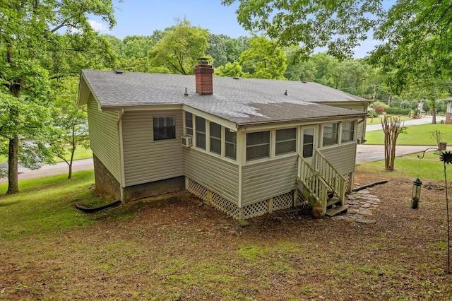 7622 Cove Ridge Dr, Hixson, TN 37343 - back of property with a shingled roof, a chimney, a lawn, and cooling unit