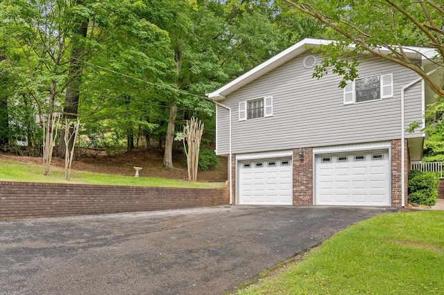 7622 Cove Ridge Dr, Hixson, TN 37343 - view of property exterior with driveway, brick siding, and a garage