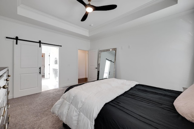 7183 Tailgate Loop, Ooltewah, TN 37363 - bedroom featuring a raised ceiling, crown molding, a barn door, carpet flooring, and a ceiling fan