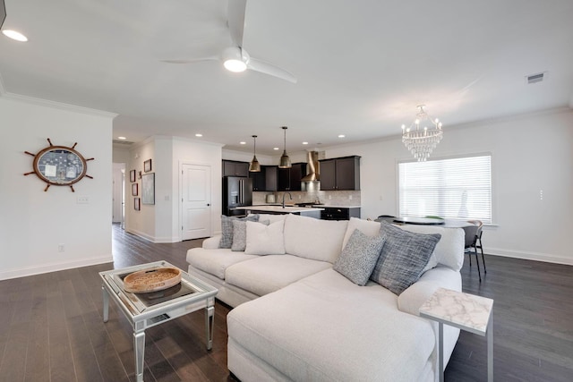7183 Tailgate Loop, Ooltewah, TN 37363 - living area with a chandelier, dark wood finished floors, recessed lighting, ceiling fan, and crown molding