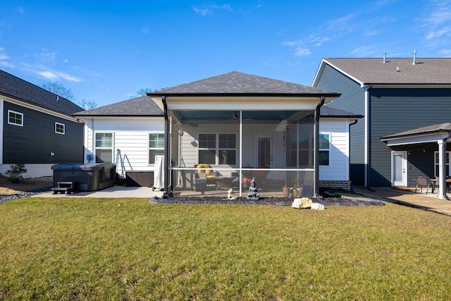 7183 Tailgate Loop, Ooltewah, TN 37363 - back of property with a hot tub, a patio, a sunroom, and a yard