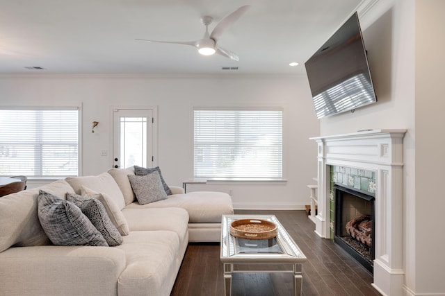 7183 Tailgate Loop, Ooltewah, TN 37363 - living area with a ceiling fan, dark wood-style floors, a tiled fireplace, crown molding, and recessed lighting