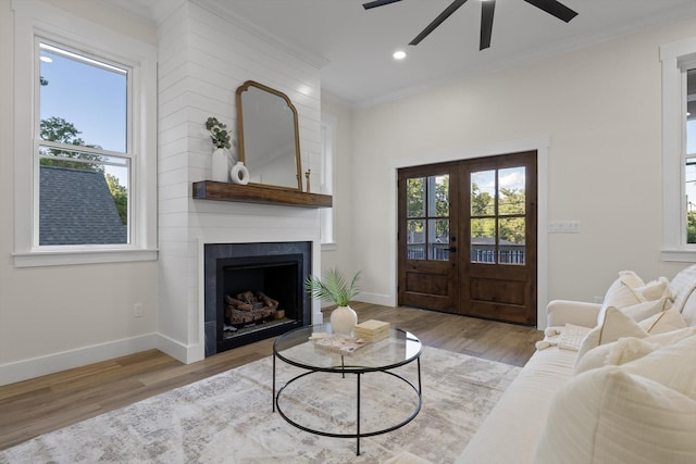 5509 Alabama Ave, Chattanooga, TN 37409 - living area featuring a ceiling fan, crown molding, wood finished floors, a fireplace, and french doors