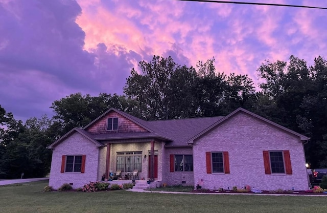 1241 Emerson Cir, Hopkinsville, KY 42240 - view of front of property with a yard, a porch, view of scattered trees, and brick siding