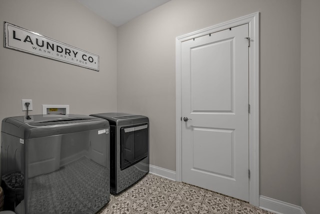 7192 Winfrey Dr, Fairview, TN 37062 - laundry area featuring washing machine and clothes dryer and light tile patterned floors