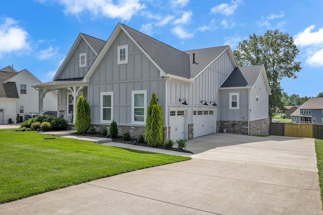 7192 Winfrey Dr, Fairview, TN 37062 - view of front of house featuring board and batten siding, concrete driveway, a garage, a shingled roof, and stone siding