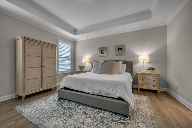 7192 Winfrey Dr, Fairview, TN 37062 - bedroom featuring a tray ceiling, wood finished floors, and ornamental molding